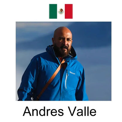 This image features Andres Valle (in a blue jacket, with a brown strap) against a light sky backdrop. A Mexican flag sits above, and his name is labeled below.