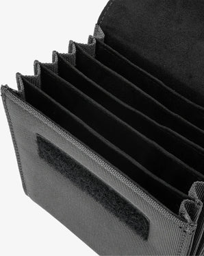 Black tactical pouch with multiple compartments on a white background