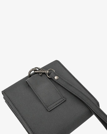 Black handbag with a strap on a white background