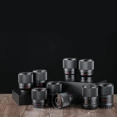 features a collection of Kase mobile phone lenses (or compact camera lens accessories), neatly arranged on a wooden surface.
