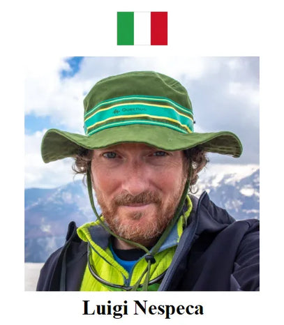 Person wearing a green hat with a mountainous background and Italian flag