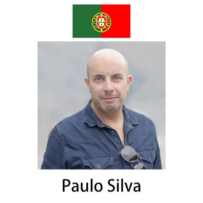 This image shows Paulo Silva (in a dark denim shirt, sunglasses hanging on the collar) against a light backdrop. A Portuguese flag sits above, and his name is labeled below.