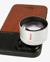 Kase lens on a wooden stand with a white background